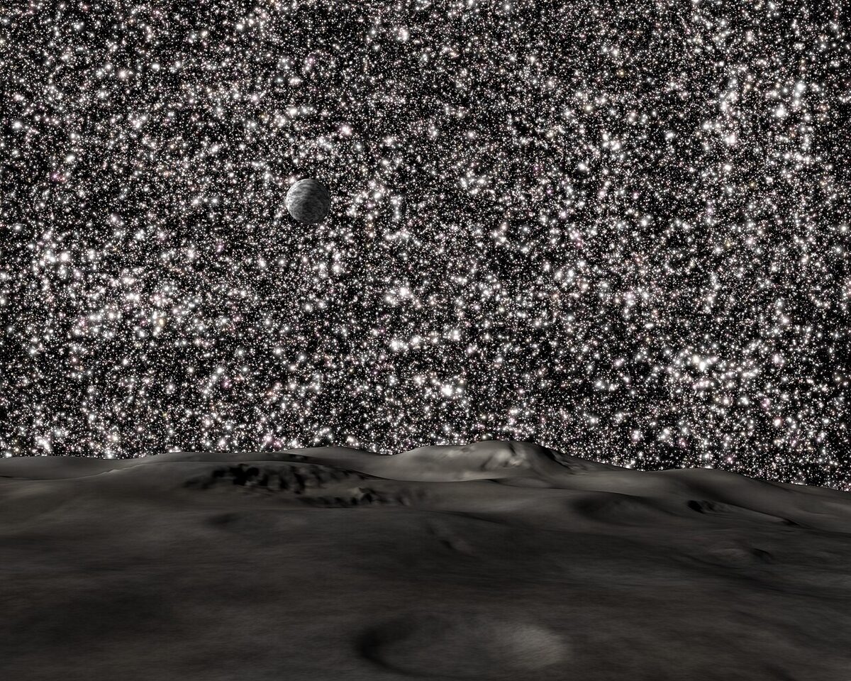 A star-filled night sky over distant hills