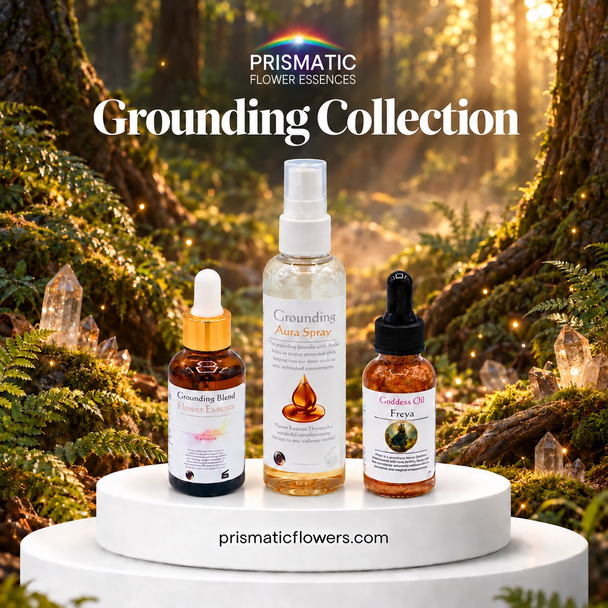 Grounding Collection, the Grounding Blend Flower Essence, Grounding Aura Spray and Freya Goddess Oil on a white podium in a sunlit forest with ferns, moss and clear quartz points, from Prismatic Flower Essences